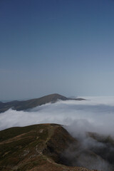 Fototapeta premium Cloud in a top mountain. Fog on the peak