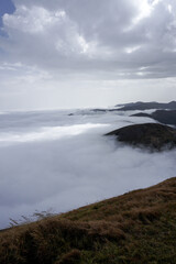 Obraz premium Cloud in a top mountain. Fog on the peak