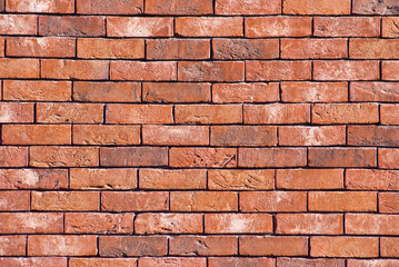 Fototapeta premium decorative red brick wall close up