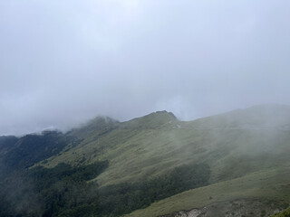 Misty Mountain Landscape With Lush Green Foreground