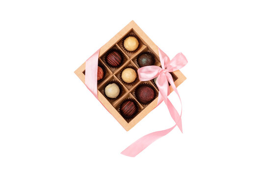 Elegant box of chocolates tied with a pink ribbon