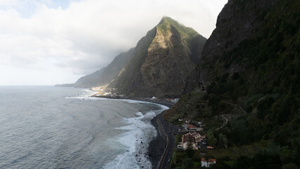Scenic Coastal Road Along Rugged Cliffs and Ocean Waves