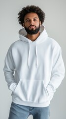 Fototapeta premium handsome hipster man with beard wearing white blank hoodie with space for your logo or design. Mockup for print