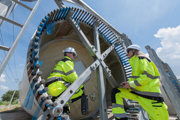 Wind Turbine Maintenance and Repair Technician, Engineer Checking Turbines working maintenance clean power generator system