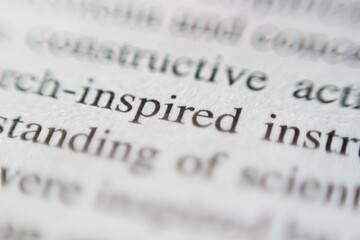 Macro Shot of the Word Inspired on a Book Page