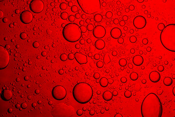 Red drink bubbles macro,water drops on red background with place for text,Close up macro bright...