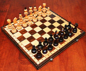 Wooden chessboard with figures ready to playing the game
