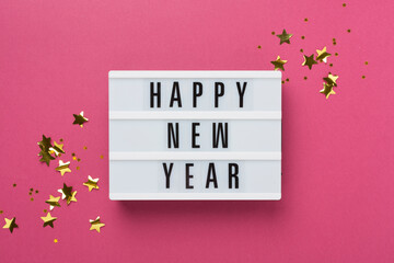 Happy New Year with decor on color background, top view