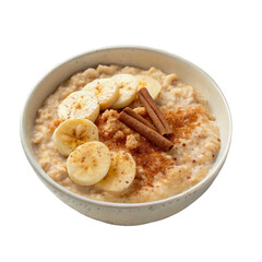 A bowl of oatmeal topped with banana slices, cinnamon sticks, and a sprinkle of brown sugar.