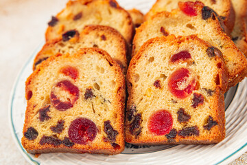 Fruit cake dessert sweet dried fruit traditional pastry, nuts meal food snack on the table copy space food background rustic top view