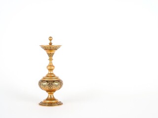 Fototapeta premium An elegant brassy cezve with intricate detailing on a clean white background, isolated, brewing