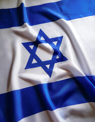 Israel flag waving in the wind on side position provides copy space for text isolated