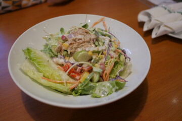 Fresh salad preparation restaurant kitchen food photography cozy atmosphere close-up healthy eating concept