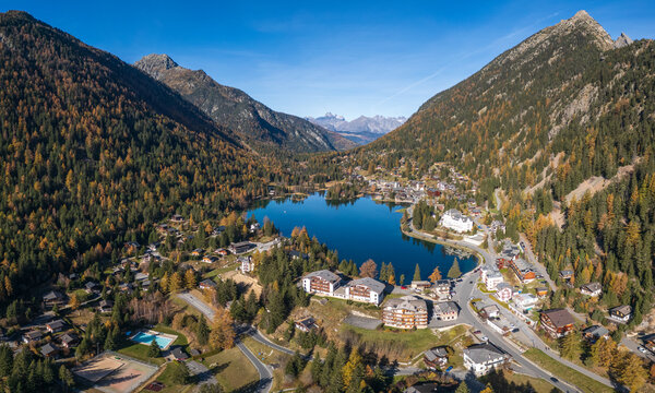Amazing aerial autumn drone view of mountains, lake and village at Champex-Lac in the Swiss Alps in the Canton of Valais