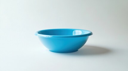 A Simple Blue Plastic Bowl on a White Background