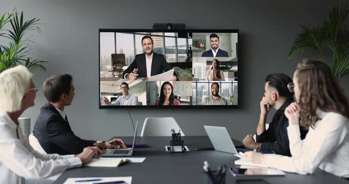 Diverse multinational business partners, clients and company executive managers lead virtual meeting using videoconferencing application. Virtual meeting event, remote negotiations, modern technology