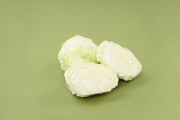 Fresh ripe cabbage vegetable isolated on a green background