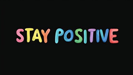 Motivational phrase “Stay positive” on a black background written in cheerful colorful letters