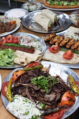 The most common variety of kebab is marinated lamb or beef cooked on a skewer. Vegetables are sometimes cooked along with them, wherein typical vegetables include eggplant, tomato, bell pepper, onions