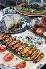 The most common variety of kebab is marinated lamb or beef cooked on a skewer. Vegetables are sometimes cooked along with them, wherein typical vegetables include eggplant, tomato, bell pepper, onions
