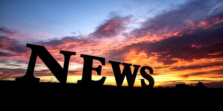 Silhouette of the Word News Formed by Newspaper Cut-Out Letters Against a Dramatic Backdrop, Capturing the Essence of Journalism and Media in a Creative Light