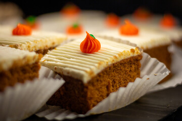 An individual slice of pumpkin cake pie dessert.