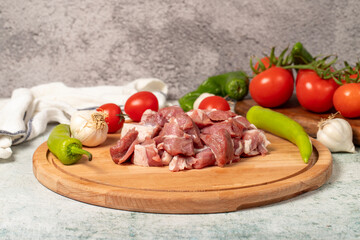 Diced cow meat. Fresh beef on a wooden floor