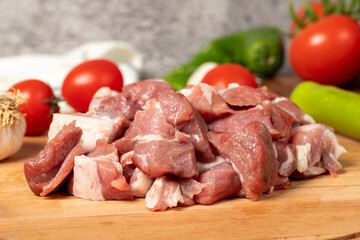 Diced cow meat. Fresh beef on a wooden floor. Close up