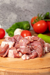 Diced cow meat. Fresh beef on a wooden floor. Close up