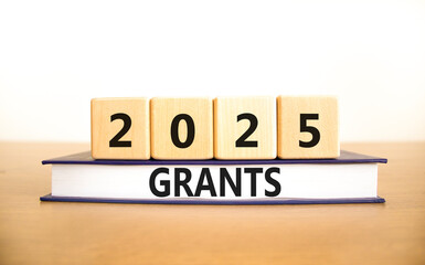 Planning 2025 grants new year symbol. Concept words 2025 Grants on beautiful wooden blocks and...