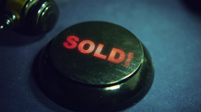 Judge's gavel strike and Sold text