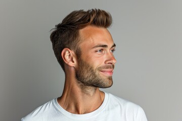 Obraz premium Close up profile of calm neat man in casual attire.