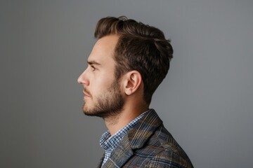Fototapeta premium Profile side photo of minded man looking wearing modern blazer jacket isolated over grey background