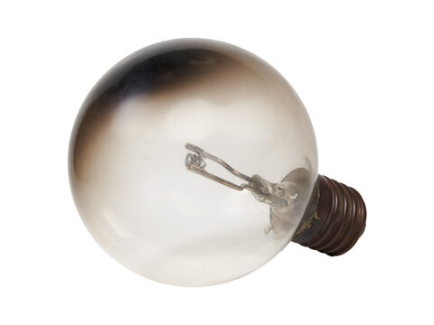 Isolated burnt out incandescent edison light bulb. Cut out transparent png