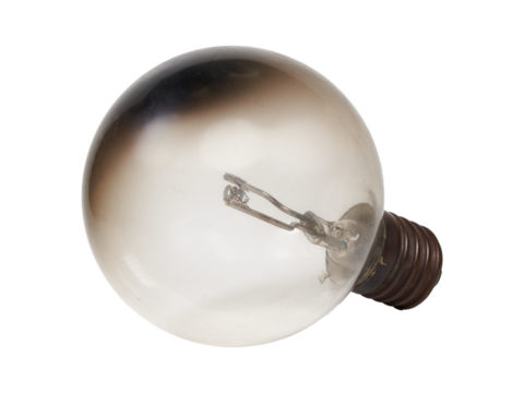 Isolated burnt out incandescent edison light bulb. Cut out transparent png