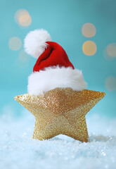  star-shaped gold glitter ornament with plush white fur on top, wearing Santa's hat, is placed against a unique soft pastel blue background.