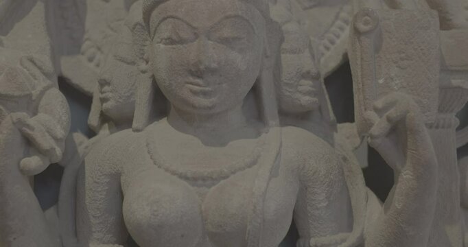 Close-up view on Ancient Stone Bas-relief Of Brahmani Or Brahmi, One Of Seven Hindu Mother Goddesses Known As Sapta Matrikas. Ungraded C LOG 2 She Is Aspect Of Adi Shakti, Possessing rajas Guna And Is