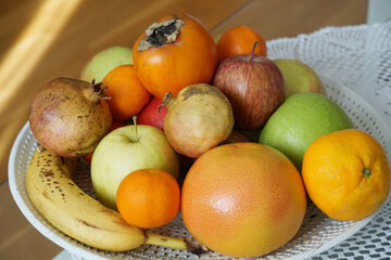 Various autumn fruits on a plate, still life scene photography