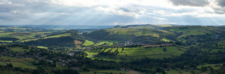 Panorama of light breaking through the clouds onto Calver village in the Derwent Valley, Peak District, UK