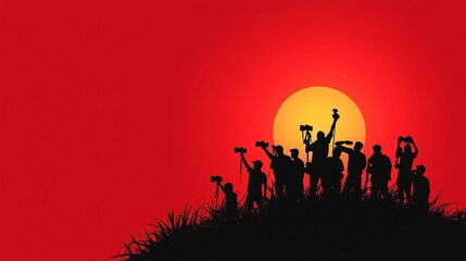 Fototapeta premium Silhouettes of photographers capturing a vibrant sunset, creating a dynamic and artistic scene.