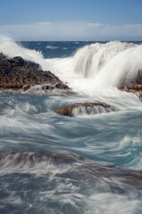 waves crashing on rocks
