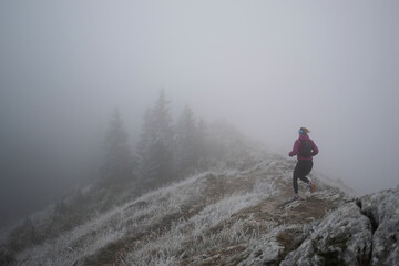 Fototapeta premium trail running woman athlete training for ultra-marathon race in a mountain