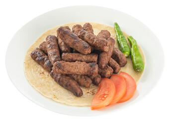 Turkish style meatballs on lavash, served with tomatoes and fresh peppers.