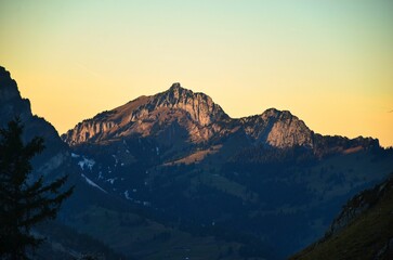 Mountain climbing in Glarus. Climb beautiful mountains outdoors in nature. Experience autumn mountain scenery in the Swiss Alps. High quality photo.