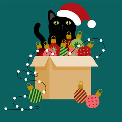 Cardboard box with Christmas decorations and black cat in Santa hat. Merry Christmas and Happy New Year celebration. Cardboard box with multicolored christmas balls