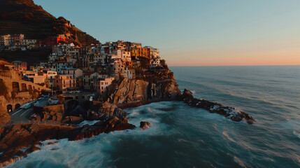 coastal mediterranean architecture, a captivating photo of the colorful cliffside buildings in manarola, italy, shows vibrant hues against the coastal landscape at sunset, embodying the beauty of