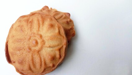 walnut and nutcracker Landscape photo of a moon cake isolated on white background 