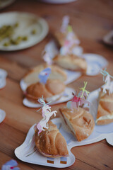 Sandwiches, snacks and desserts food served with some decoration in a birthday party