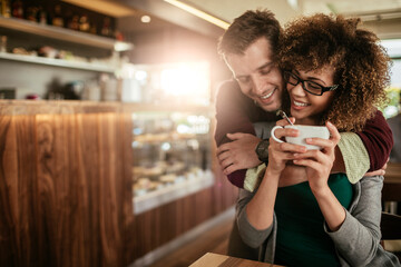 Young couple having a cup of coffee together in a cafe
