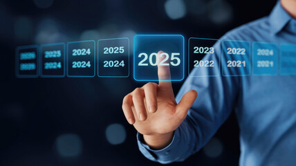 A man is pressing a button on a screen that says "2025" and is surrounded by a line of numbers
